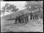Royal New Zealand Air Force pilots, all unidentified, standing on a hill at Ardmore Air Force Base, Auckland