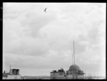 Gloster Meteor aeroplane in flight over Auckland Post Office