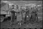 New Zealand soldiers on the Cassino Front, Italy, record messages to be broadcast home - Photograph taken by George Bull