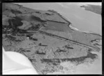 View of the Kellihers' Puketutu Island farm, with homestead and open farmland, Manukau Harbour, South Auckland