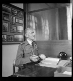 Sir Keith Park, sitting at a desk