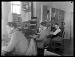 Operators (L to R), R [McVissen], F Fleetwood and L Douglas at work, Musick Point Air Radio Station, Howick, Auckland