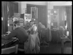 Operators (L to R), L J Young, N [Masters?] and E Ritchie at work, Musick Point Air Radio Station, Howick, Auckland