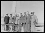 Arrival of Sir John Buchanan (far right), Auckland, including other unidentified men, at an unidentified wharf
