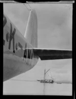 Harbour, Suva, Fiji, showing sailing ship and tail of Tasman Empire Airways Ltd flying boat 'Aotearoa' ZK-AMA