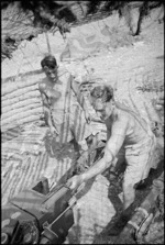 N Hunt and E J Betts maintain NZ Divisional Artillery gun in Cassino area, Italy, World War II - Photograph taken by George Kaye
