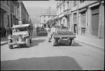 A New Zealand Dingo makes its way along a street in Sora, Italy, World War II - Photograph taken by George Kaye
