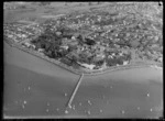 Mission Bay, Auckland, includes wharf, boats, shoreline, housing and farmland