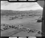 Motueka aerodrome, Tasman District, including houses and rural area, with hills beyond