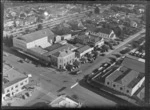 Rotorua, includes township, RMTC buildings, Hobbs for genuine souvenirs, Bank of New South Wales, McKenzies store, cars, road crossing, church and housing