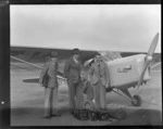 Auster tours, (L to R), T Ewart, D Greig and Leo Lemuel White, next to an Auster airplane, Rongotai airport, Wellington