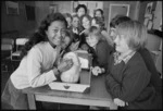 Primary school children learning how to perform mouth-to-mouth resuscitation