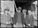 Mr H F Guy (Kaikohe Dairy Company, representing Mayor) (from left), G H Berry (Businessmen's Association) and W Stewart (Chamber of Commerce), standing in front of a Bristol Freighter aircraft, Kaikohe