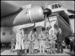 Bristol Freighter tour, Rotorua, showing crew with Guides Emily, Rangi, and Bubbles and Mr N E Higgs, standing near a Bristol Freighter 'Merchant Venturer' aircraft