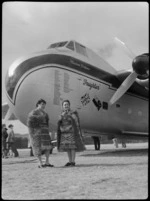 Bristol Freighter tour, Rotorua, showing Guide Bubbles and Guide Emily, wearing Maori cloaks and piupiu skirts, including a Bristol Freighter 'Merchant Venturer' aircraft, with a list of airports visited on the nose and a British and New Zealand flag