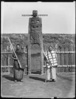 Pringle, Thomas, 1858-1931 :Hurae Puketapu and Te Whenuanui, standing in front of the gateway at Mataatua