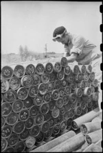 J Cobb secures a load of tank shells to a Bren carrier before moving in the advance towards Florence, Italy, World War II - Photograph taken by George Kaye