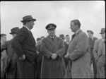 Mr NE Higgs, Air Vice-Marshal A de T Nevill, Captain R Ellison, and other unidentified men at Paraparaumu Airport, Kapiti Coast District, during Bristol Freighter transport aeroplane tour