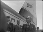 Mr Elliot, Mr Higgs and Mayor of Masterton Mr W Kemp, alongside Bristol Freighter transport aeroplane 'Merchant Venturer', [at Hood Aerodrome?] Masterton