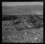 View east over the Wellington City suburb of Mount Cook with the Basin Reserve in foreground, Wellington College and Wellington East Girls College, the Mount Victoria tunnel to Hataitai and Evans Bay with the Miramar Peninsula beyond