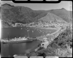 Passenger ship berthed at Picton wharf, yachts and Picton town, Marlborough region