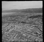 The suburb of Waiwhetu and Waiwhetu Road and Primary School, Woburn Railway Station with Whites Lines East Road Bridge, looking to Petone, Lower Hutt Valley, Wellington Region