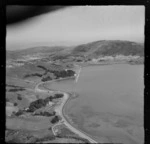 View of Porirua Harbour and the construction of the new Porirua-Paremata railway line, looking south to Tawa Flat and Colonial Knob beyond, Porirua District, Wellington Region