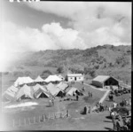 Tents at Jerusalem (Hiruharama) Pa, south of Ruatoria, for visitors attending the hui for the posthumous awarding of the Victoria Cross to Te Moananui-a-Kiwa Ngarimu, at Ruatoria.