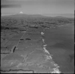 Views of the north New Plymouth coastline with the coastal settlement of Urenui to Mount Taranaki beyond, North Taranaki Region