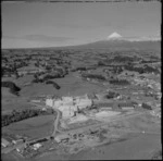 View of fertiliser works with farmland and Mount Taranaki beyond, New Plymouth, Taranaki Region