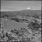 New Plymouth Racecourse with Eliot Street and State Highway 3 in foreground, with farmland and Mount Taranaki beyond, Taranaki Region