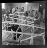 Sea Scouts building boats in a workshop