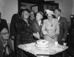 Elderly citizens of Hastings cutting cake