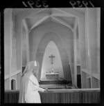 Unidentified nun standing on the balcony, at the new Chapel at Calvary Hospital, Berhampore, Wellington