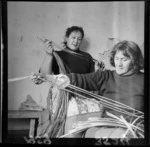 May (Mei) Walker and Netta Morgan of Waiwhetu preparing kiekie for tukutuku panels for the Waiwhetu meeting house
