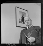 Portrait of Air Force Marshal Sir Arthur Nevill, the Director of Civil Aviation, includes picture of Queen Elizabeth II and Rongotai Aerodome functional plan manual.