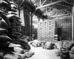 Storehouse with sacks of (grain?)