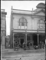 Shop front and garage of Adams Ltd, cycle and motor importers, Wanganui