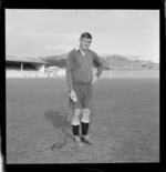 All Black No.8 Peter Jones in rugby gear standing on Athletic Park Rugby Grounds with a microphone, Wellington City