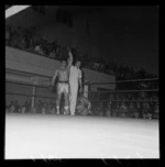 Boxing match, Tuna Scanlan vs Dick Williams at Wellington Town Hall, showing referee declaring Tuna Scanlan the winner