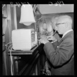 Two unidentified men, eating a meal, at Sir Truby King Day, in Sir Frederic Truby King's house, Melrose, Wellington