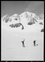 Mountaineers on Albert Glacier, waving to an aeroplane flying over the Southern Alps