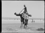 Maranui Surf Life Saving Club members doing gymnastics, Lyall Bay, Wellington