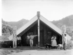 Unidentified Maori group outside a meeting house at Tieke, upper Whanganui River