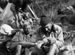 William Davidson examining John Pascoe's foot, Kaikoura ranges