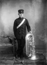 Portrait of a uniformed man with a tuba