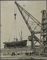 Floating Crane `Hikitia' lifting the Uta into the water from the breastwork at Thorndon, Wellington Harbour