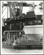 Floating crane `Hikanui' unloading componants of a large truck crane, Auckland