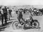Wellington Photographic Works :Percy Coleman on Royal Enfield motorcycle at Waikanae Beach