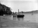 Men and a punt at Whanganui Inlet